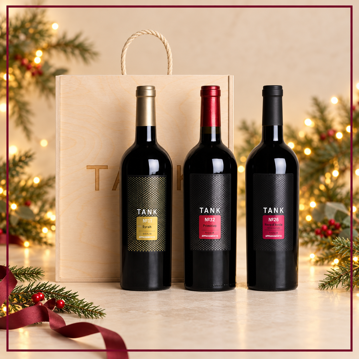 TANK Red Wines of Sicily No.11 Syrah, No.32 Primitivo and No.26 Nero d'Avola wooden gift set on Christmas ivory backdrop with burgundy border
